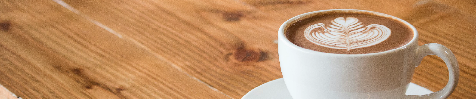 Photo of a coffee cup with decorative foaming on top